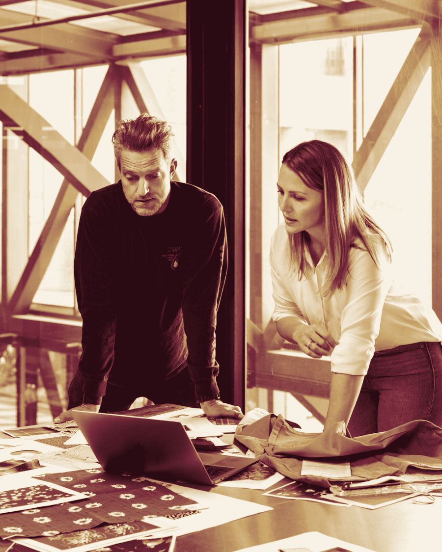 Two architects working together at a standing table