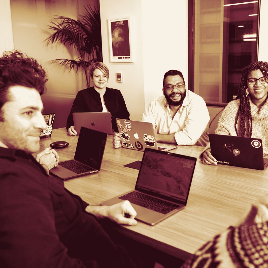 A team in a working session around a table